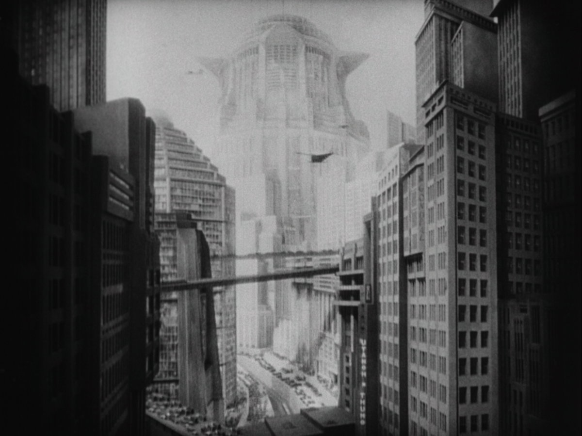 METROPOLIS (1927) regissert av Fritz Lang fremstiller en høyteknologisk og dystopisk fremtid - nemlig året 2026.<br>